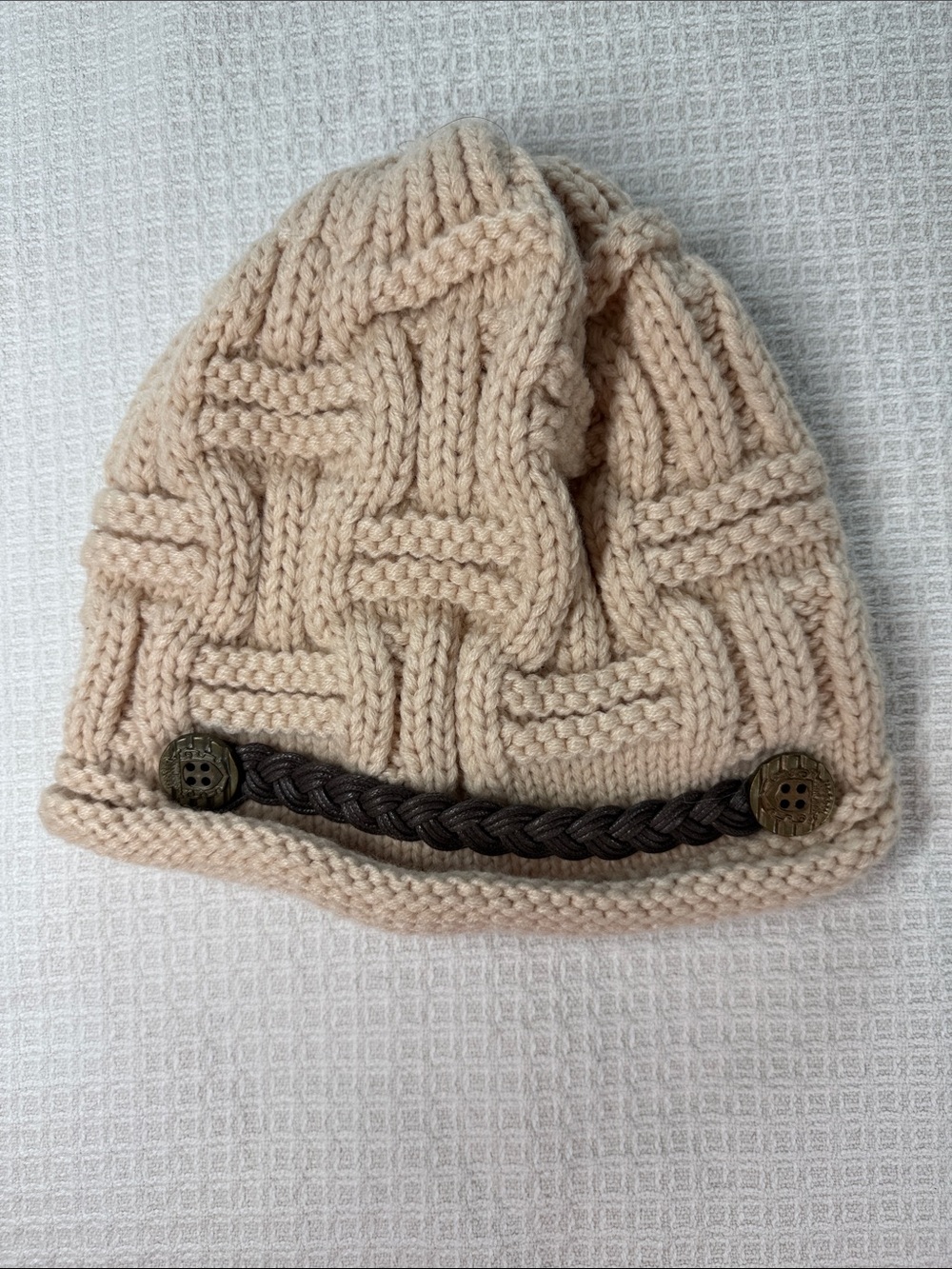 Ivory/ cream chunky knit hat with button and faux leather strap detail